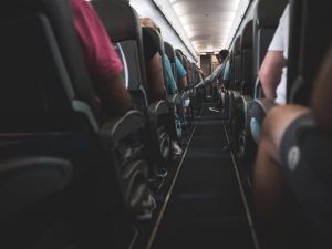 airplane-isle-passengers-in-seats