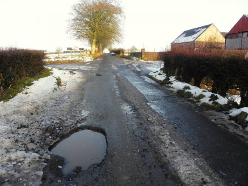 snowy-countryside-pothole-road
