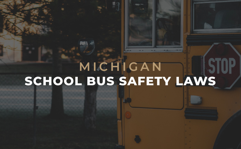 School Bus in parking lost with text "Michigan School Bus Safety Laws"