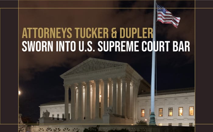 US Supreme Court at night with flag - swearing in text