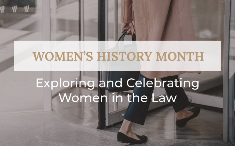 Women in long coat with briefcase walking through door with title Women's History Month