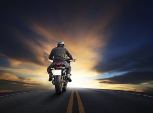 man riding motorcycle on highway