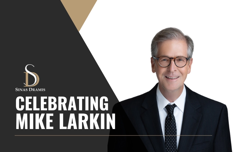 Portrait of attorney Mike Larkin featured in a Sinas Dramis Law Firm retirement and recognition announcement