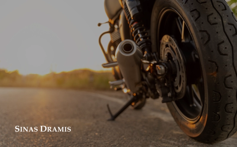 Close-up of a motorcycle parked on a roadway in Michigan, representing motorcycle safety awareness and rider preparedness.