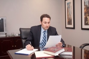 tom-sinas-attorney-at-desk